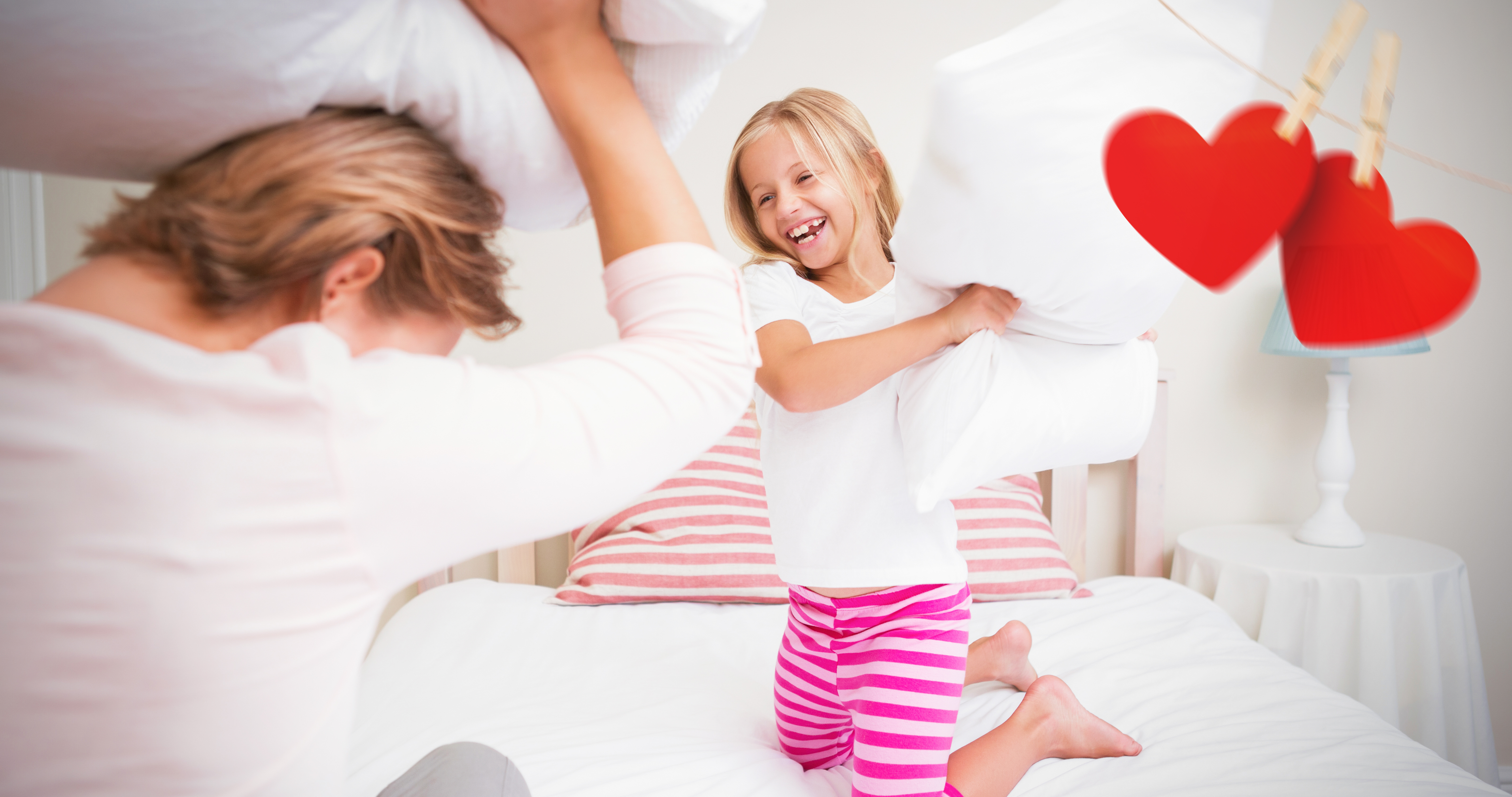 Composite Image Of Mother And Daughter Fighting With Pillows On Heber 